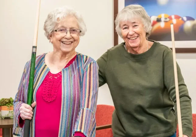Amaran_Casual_Photos_-_05_dtwzbh (1) (1) Smiling ladies playing billiards at Amaran Assisted Living in Albuquerque NM